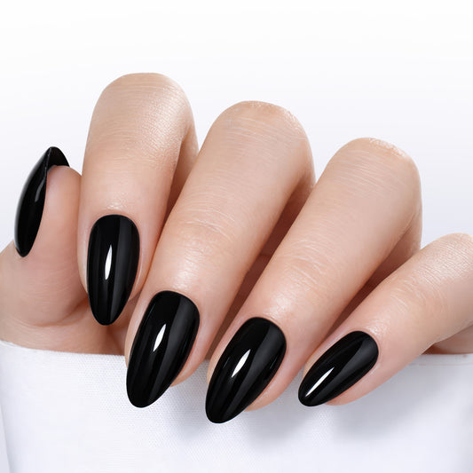Black almond-shaped press-on nail tips by UNA GELLA, reusable soft gel false nails in 16 sizes, 32-piece set.