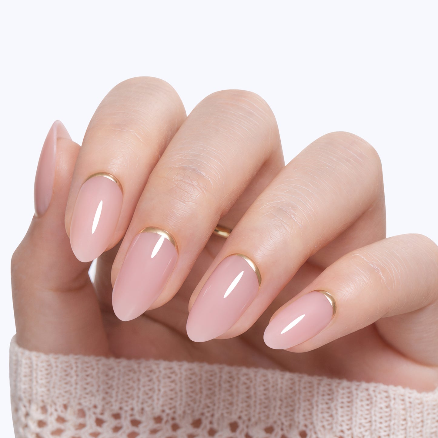 UNA GELLA soft gel press-on nails in nude pink with gold rim, almond shape, 16 sizes, perfect for elegant, easy-to-wear nail styles.