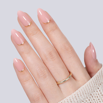 UNA GELLA nude pink almond-shaped press-on nail tips with gold rim, 16 sizes, designed for easy application and natural look.