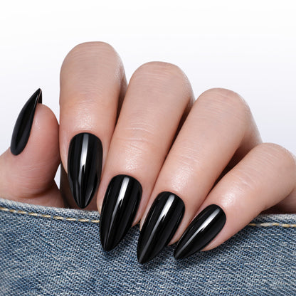 Medium almond-shaped black press-on nail tips by UNA GELLA, reusable soft gel, 32-piece set for DIY manicure.