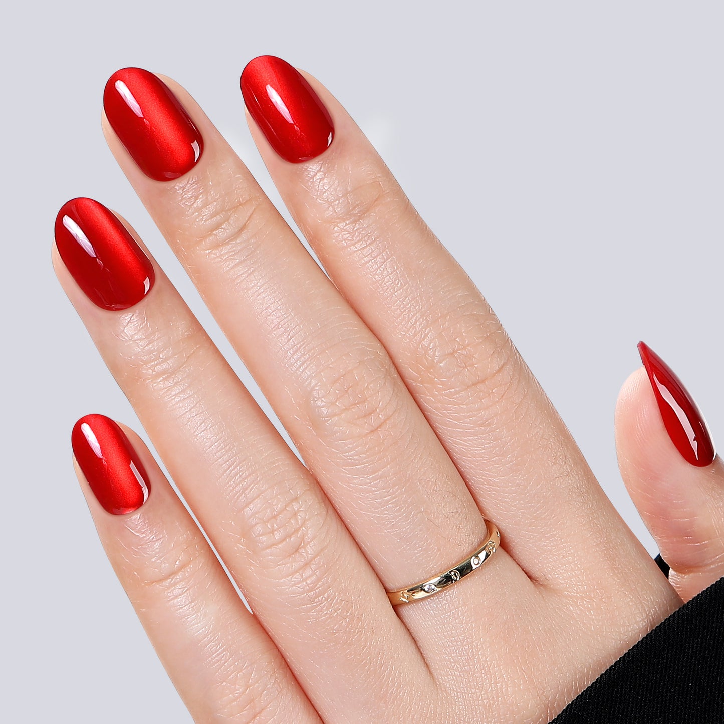 Red cat-eye press-on nail tips by UNA GELLA, oval soft gel nails in 16 sizes, 32-piece set for DIY nail art.