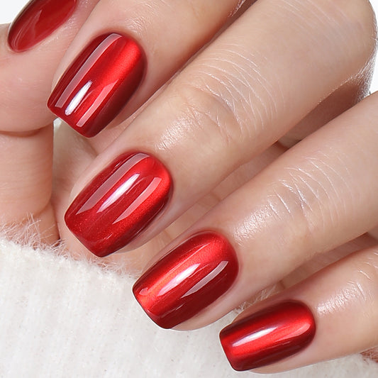 Red cat eye press-on nails by UNA GELLA, short square gel nail tips, reusable and ideal for DIY nail designs.