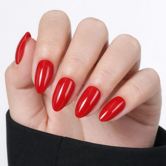 Reusuable almond-shaped red press-on nail tips by UNA GELLA, 32-piece set with 16 sizes for DIY nail designs.