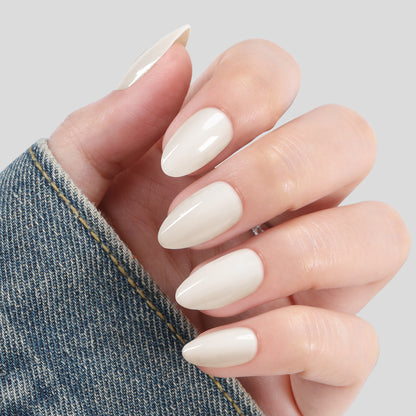 White almond-shaped press-on nail tips by UNA GELLA, salon-grade reusable gel for natural-looking manicures.