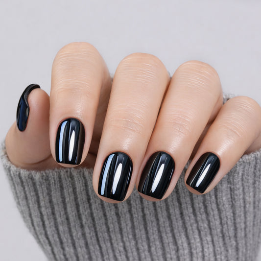 Short black chrome press-on nails by UNA GELLA, squoval-soft gel finish, 32-piece set with mirror shine design.