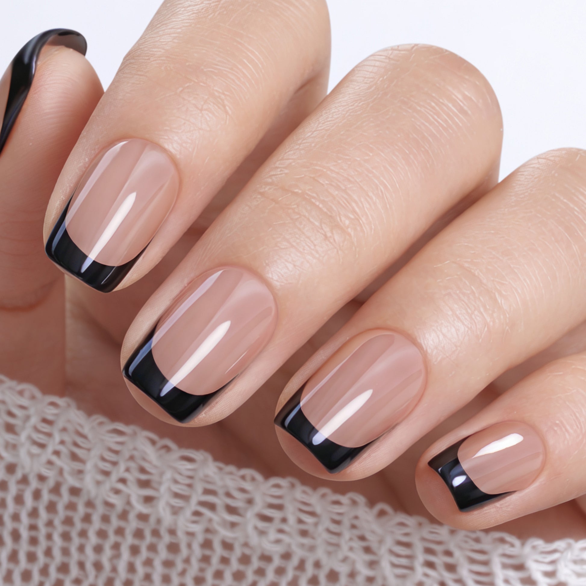 UNA GELLA 32-piece soft gel press-on nails set featuring black chrome finish, French style, short squoval shape.