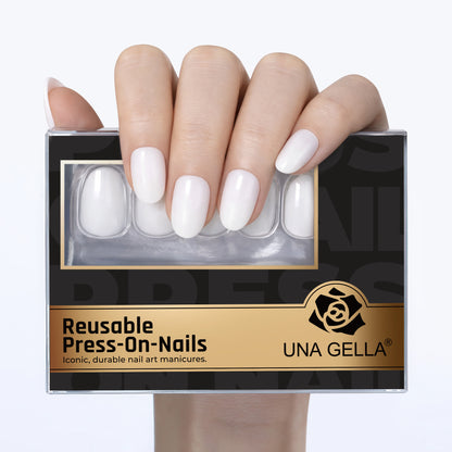 Set of 32 white oval press on nails by UNA GELLA, reusable soft gel squoval soft nails for DIY nail design.