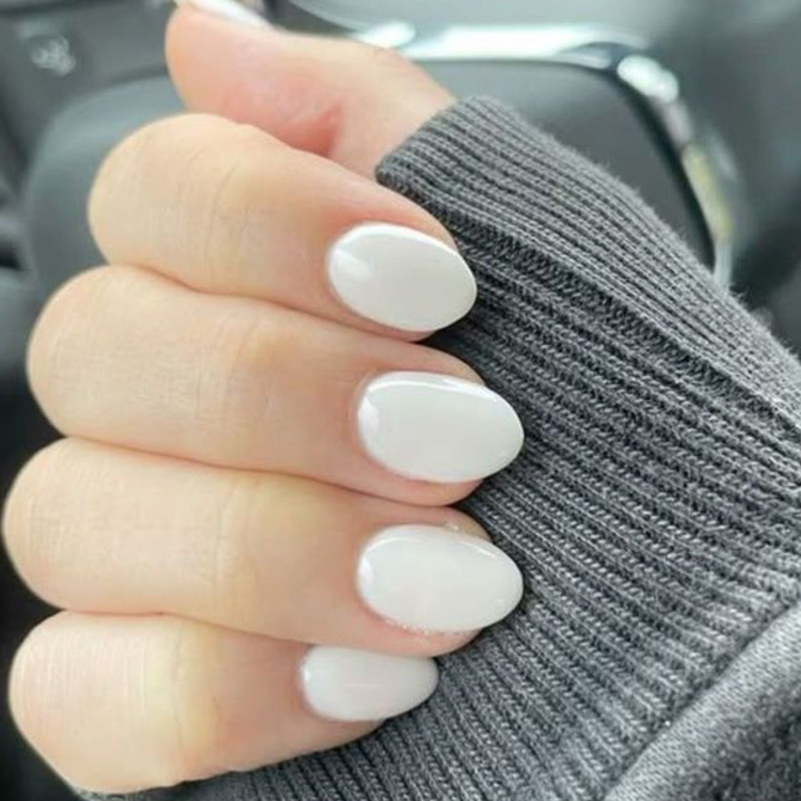 White oval press-on nails set by UNA GELLA featuring 32 reusable soft gel squoval nails in 16 sizes for DIY nail design.