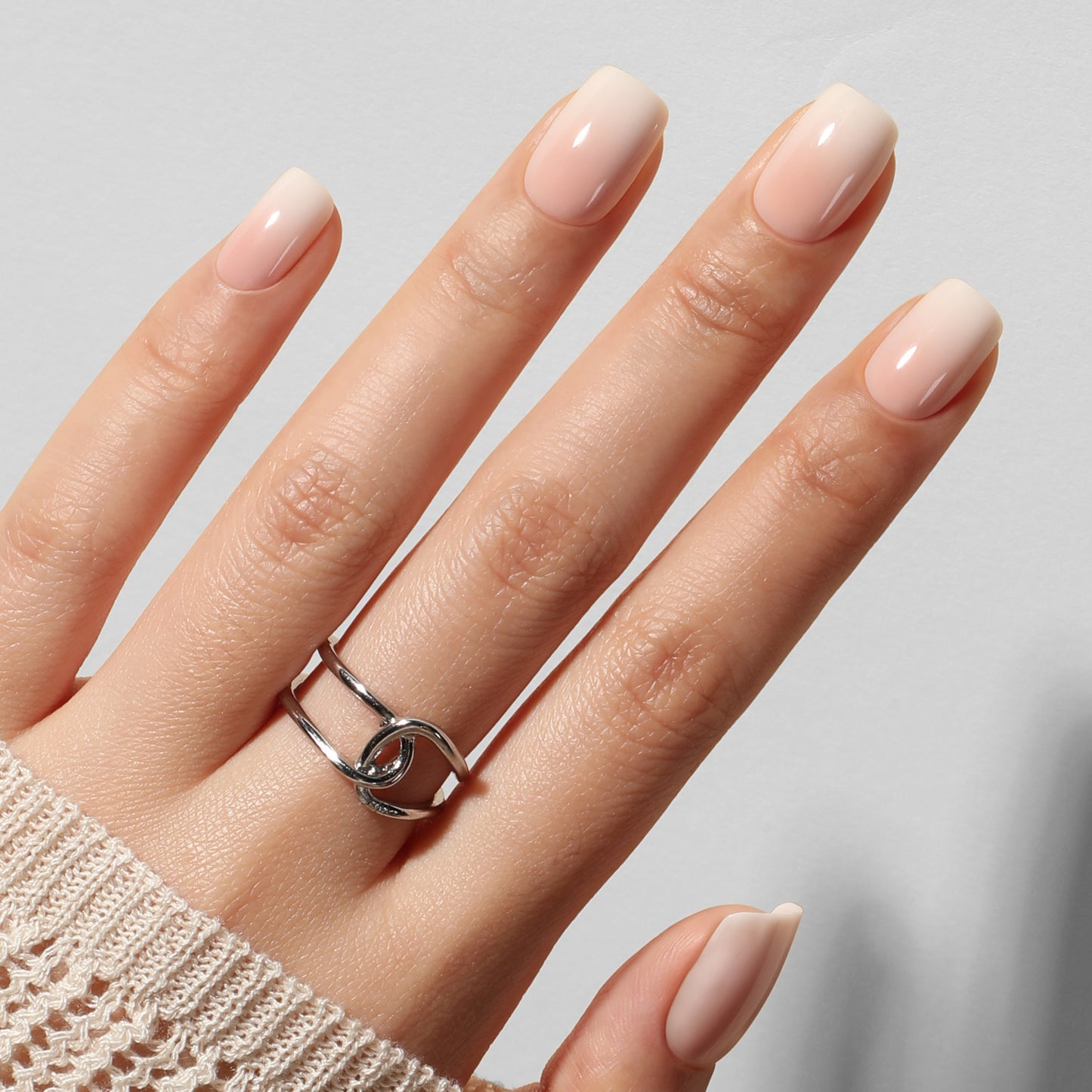 UNA GELLA short squoval press-on nails with nude cream ombre design, 32-piece set of reusable gel nails, soft and stylish.