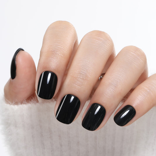 Short round black press on nails by UNA GELLA, soft gel, 32 pieces in 16 sizes, ideal for DIY nail art and quick manicures.
