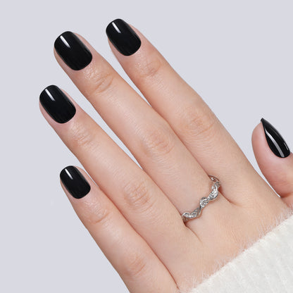 Short round black press-on nails by UNA GELLA, soft gel, 32-piece set with 16 sizes, perfect for DIY nail art.