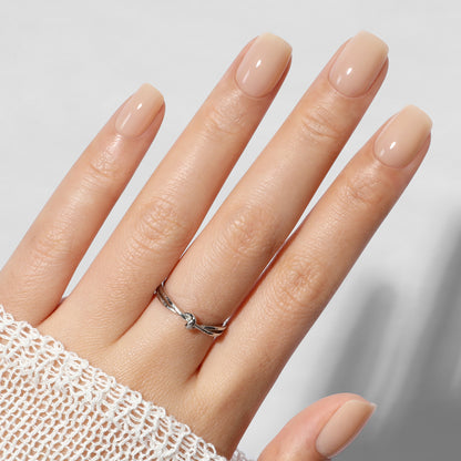 UNA GELLA nude squoval soft gel press-on nails, short square tips, reusable fake nails in a set of 32 pieces.
