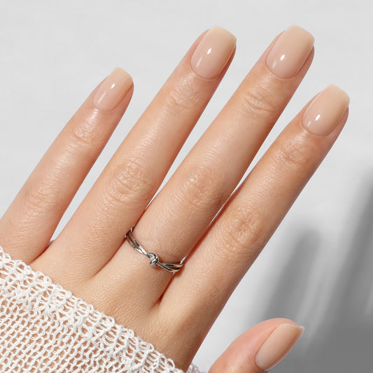 UNA GELLA nude squoval soft gel press-on nails, short square tips, reusable fake nails in a set of 32 pieces.